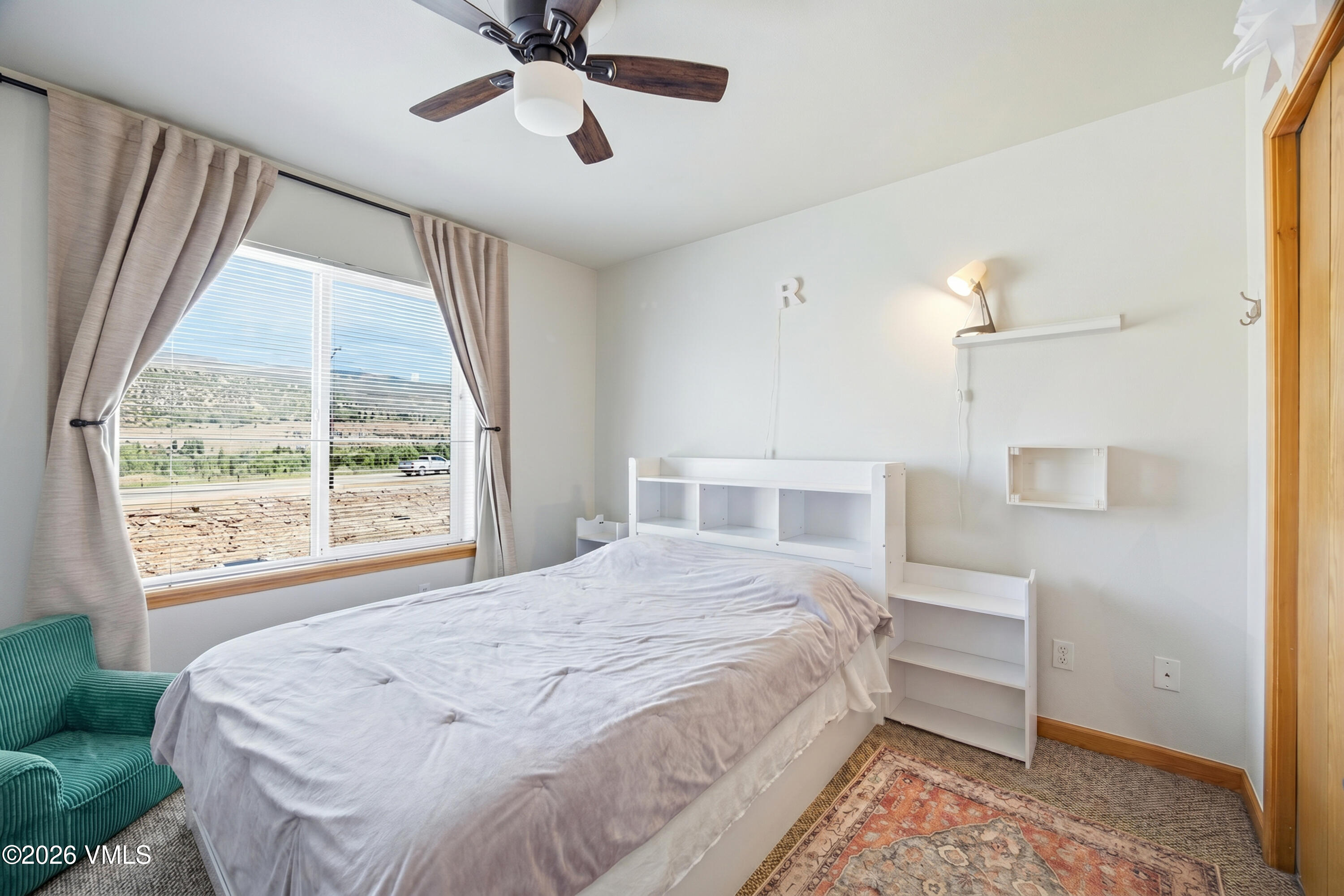 107 Stonegate Circle Edwards, CO 81632 - Photo 13 of 26 a bedroom with a large bed and a window