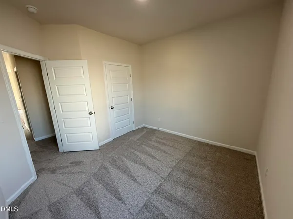 an empty room with a wooden door