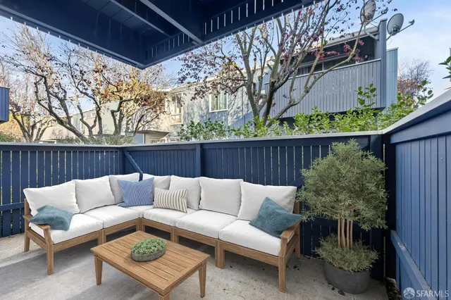 a backyard with a couch and a garden