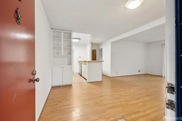 a view of a kitchen with a sink and cabinets