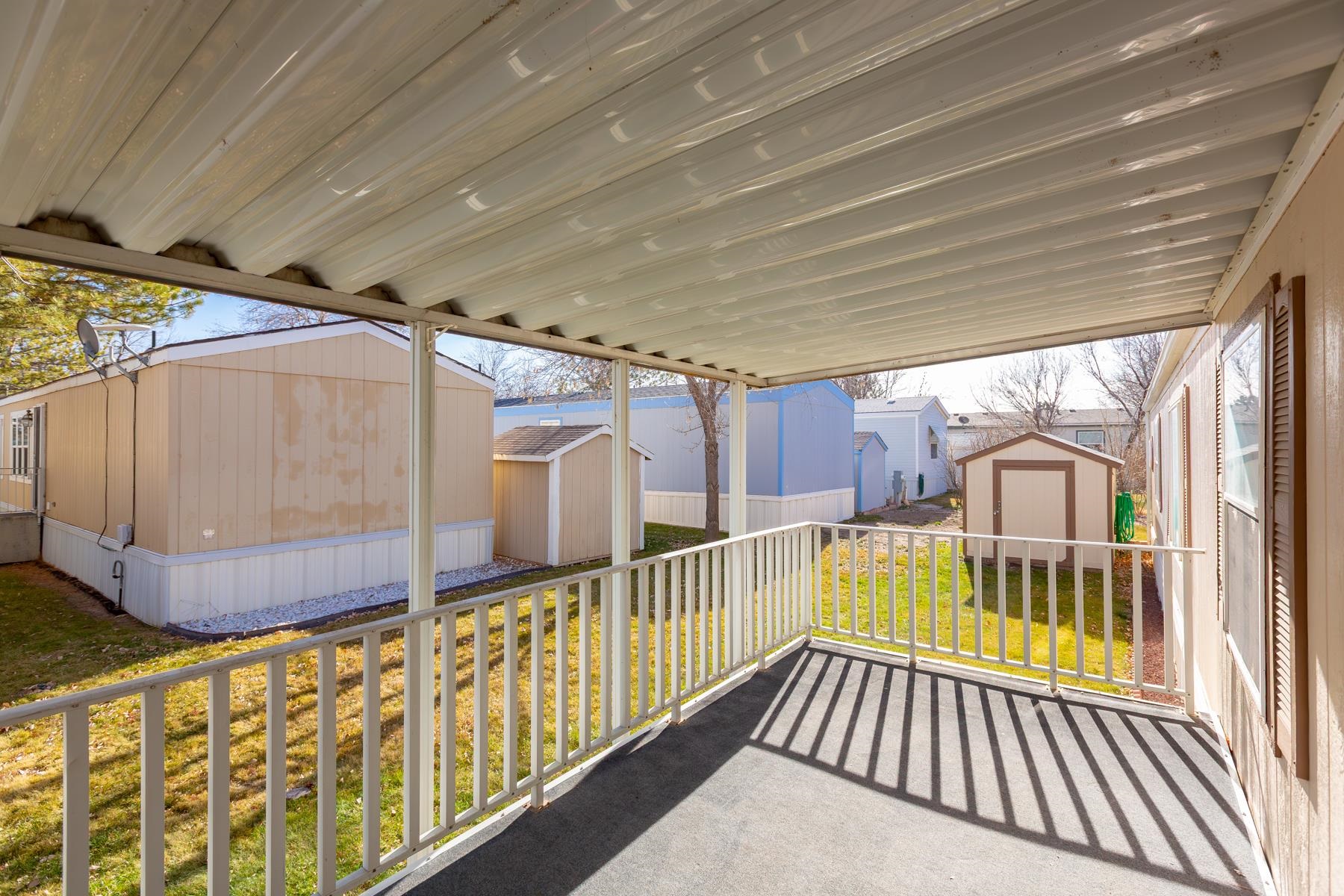 435 32 Road, Unit 521 Clifton, CO 81520 - Photo 11 of 26 a view of a house with wooden deck