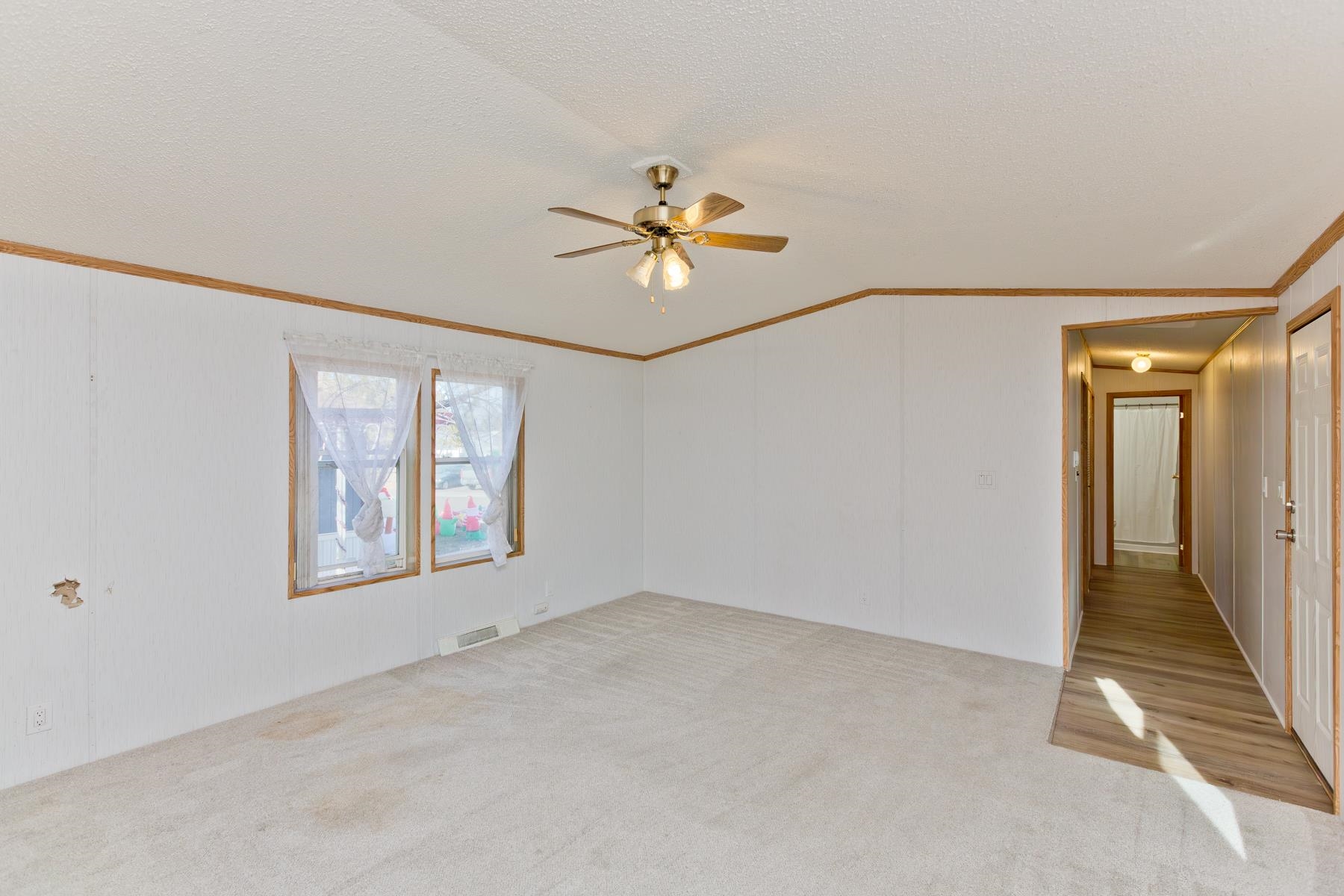 435 32 Road, Unit 521 Clifton, CO 81520 - Photo 18 of 26 wooden floor in an empty room with a window