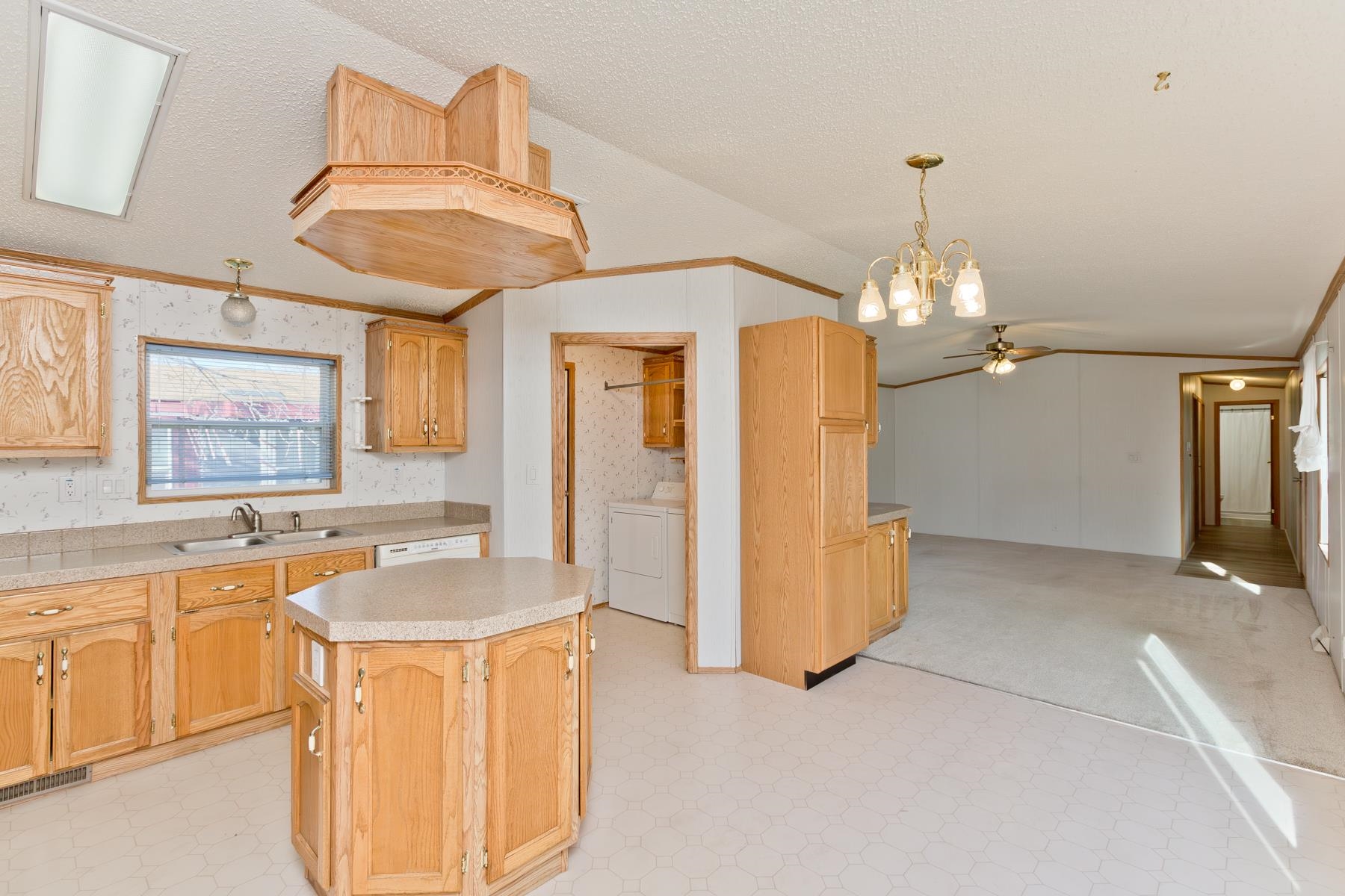 435 32 Road, Unit 521 Clifton, CO 81520 - Photo 20 of 26 a view of a kitchen with a sink and chandelier