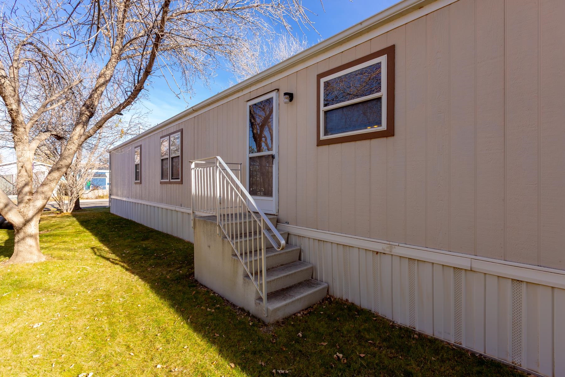435 32 Road, Unit 521 Clifton, CO 81520 - Photo 5 of 26 a view of a house with a yard