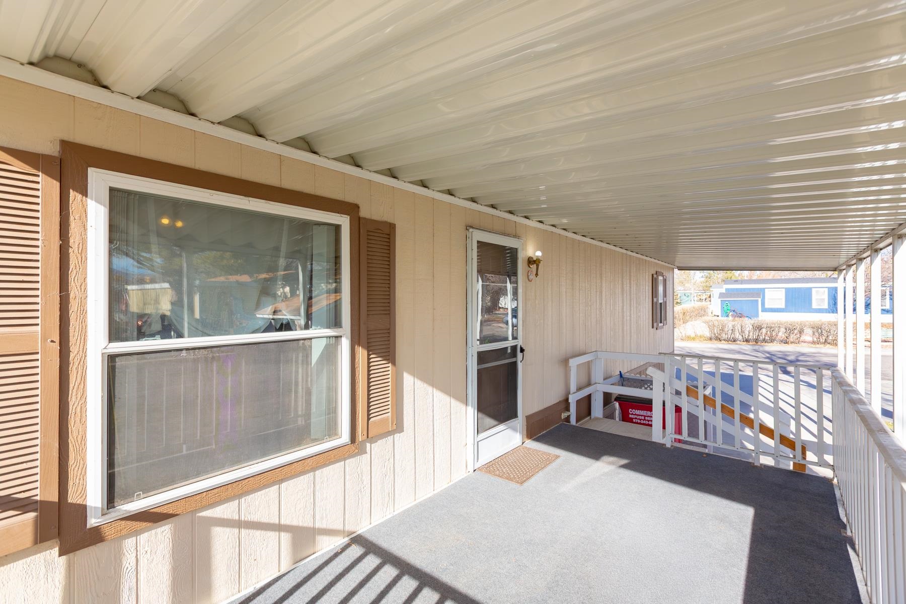 435 32 Road, Unit 521 Clifton, CO 81520 - Photo 9 of 26 a view of a porch with table and chairs