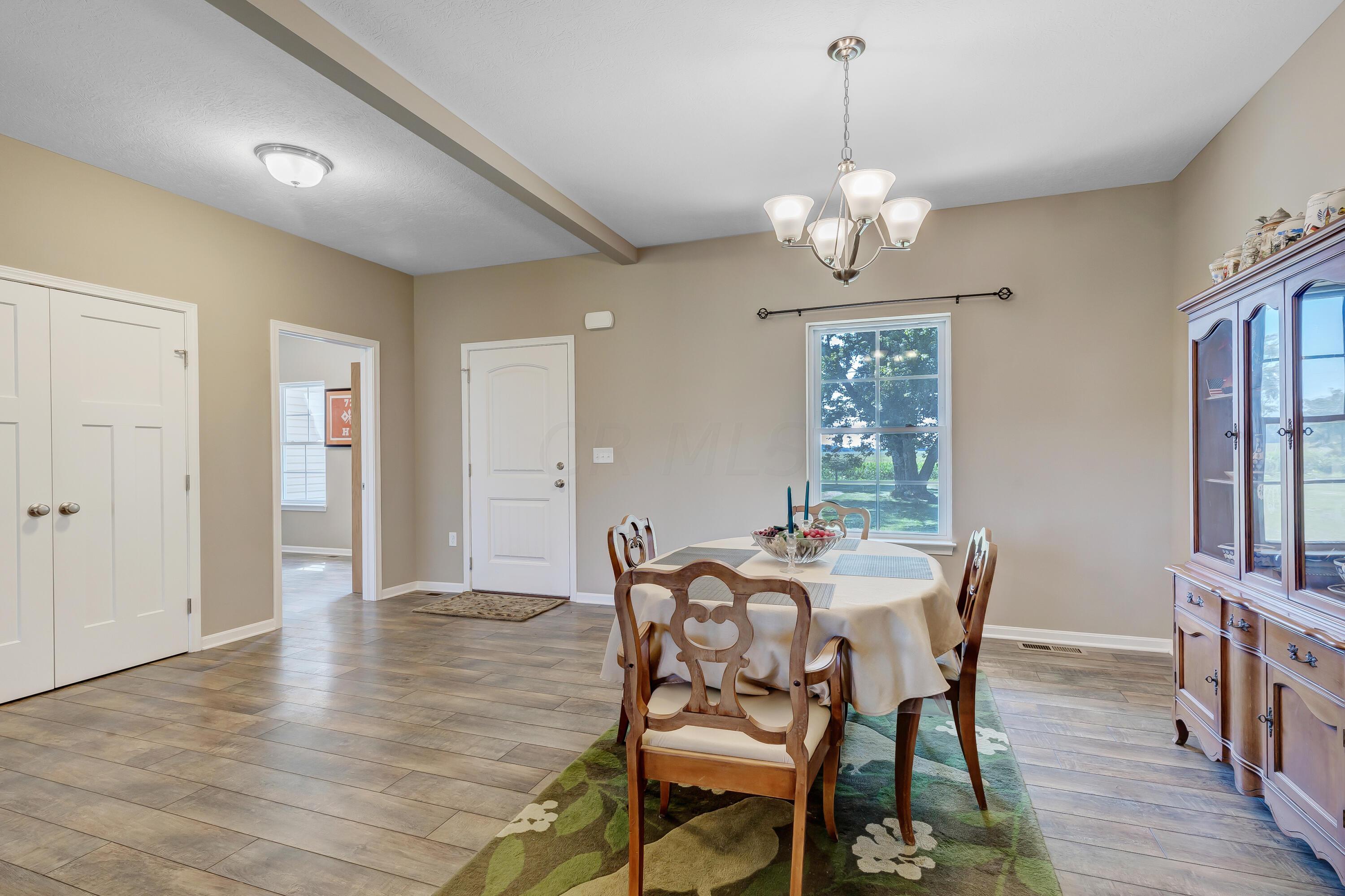 • Laminate flooring • Tan painted walls • Chandelier