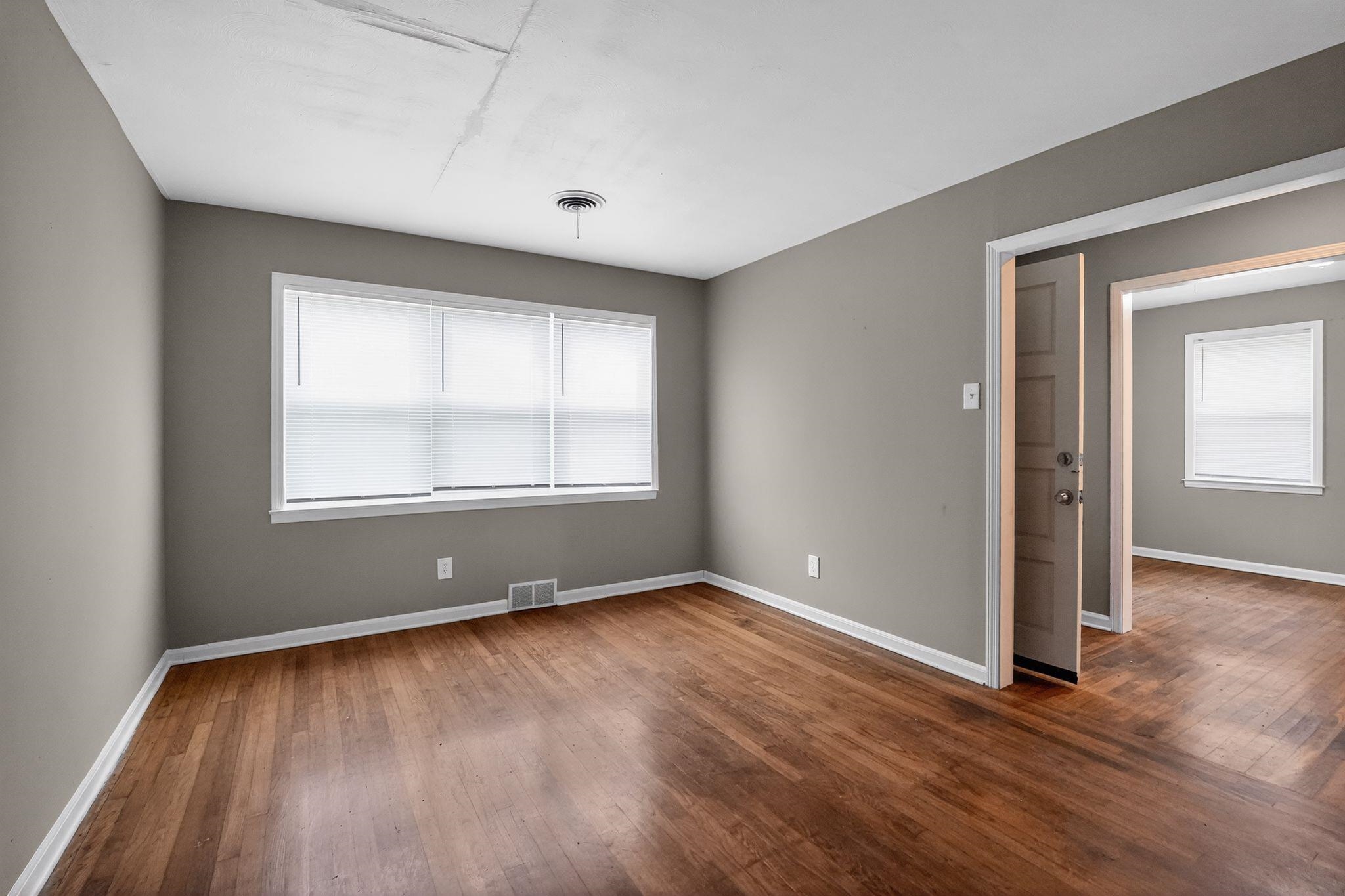 134 West Holmes Road Memphis, TN 38109 - Photo 17 of 30 Empty room featuring dark wood finished floors