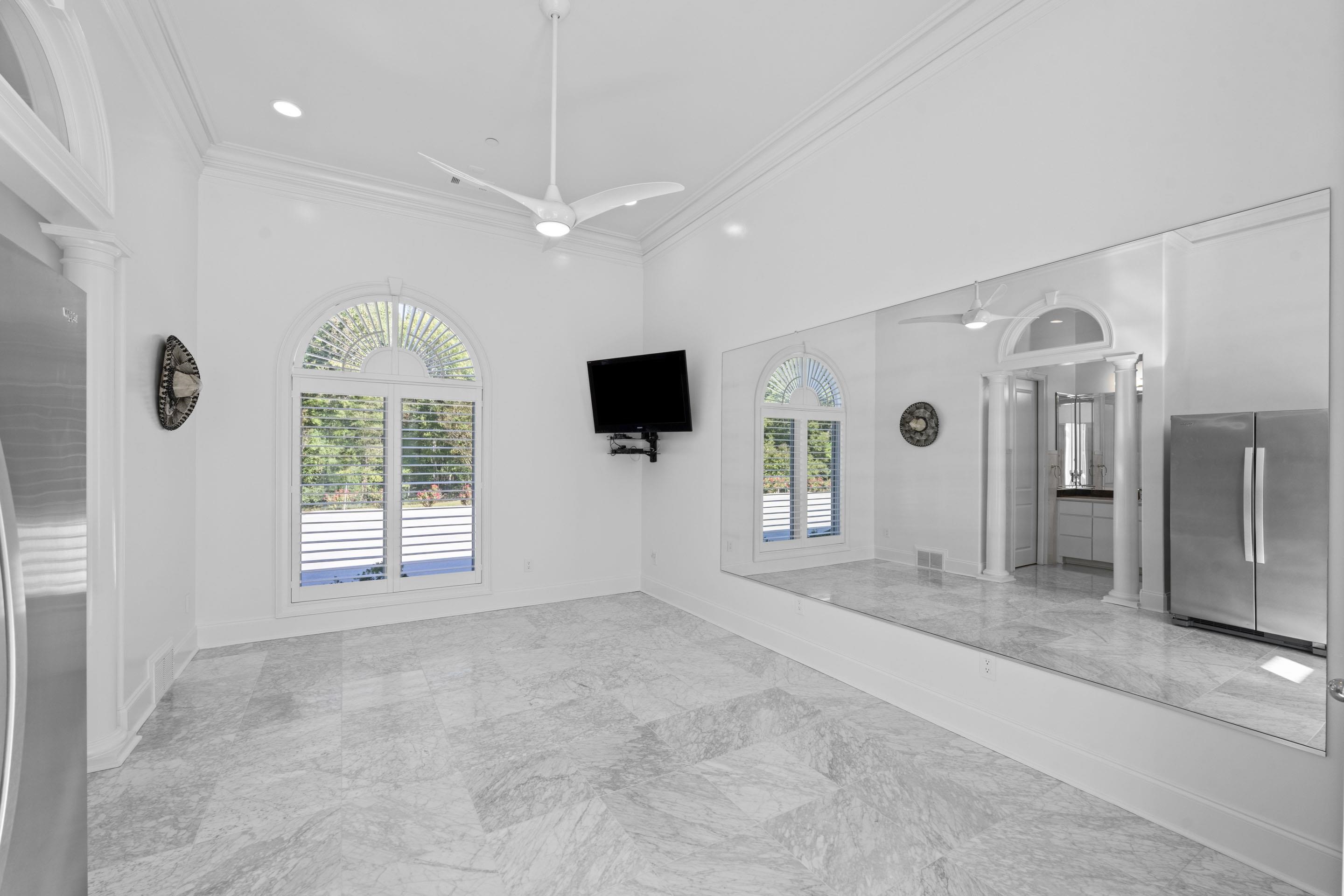 881 Bray Station Road Collierville, TN 38017 - Photo 12 of 40 Unfurnished living room featuring ornamental molding, healthy amount of natural light, light marble finish floors, recessed lighting, and ceiling fan