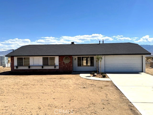 36749 Esaw Road Lucerne Valley, CA 92356 - Photo 1 of 22 a front view of a house with yard