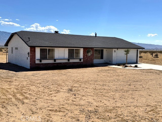 36749 Esaw Road Lucerne Valley, CA 92356 - Photo 2 of 22 a house view with a outdoor space