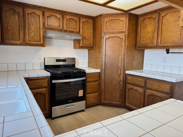 36749 Esaw Road Lucerne Valley, CA 92356 - Photo 8 of 22 a kitchen with stainless steel appliances granite countertop a refrigerator and cabinets