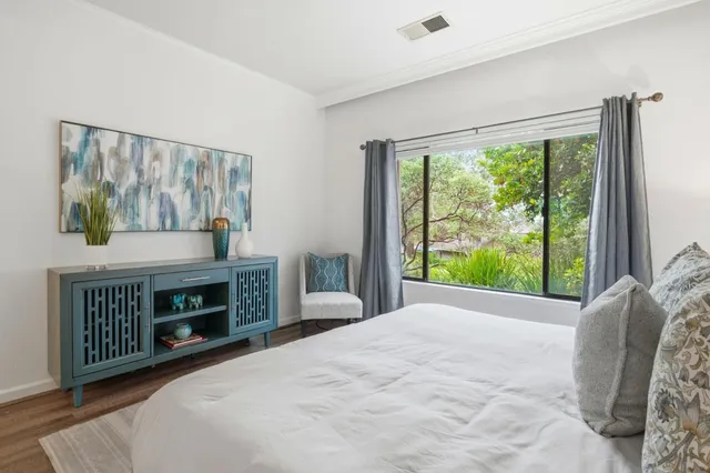 a bedroom with a bed and a fireplace