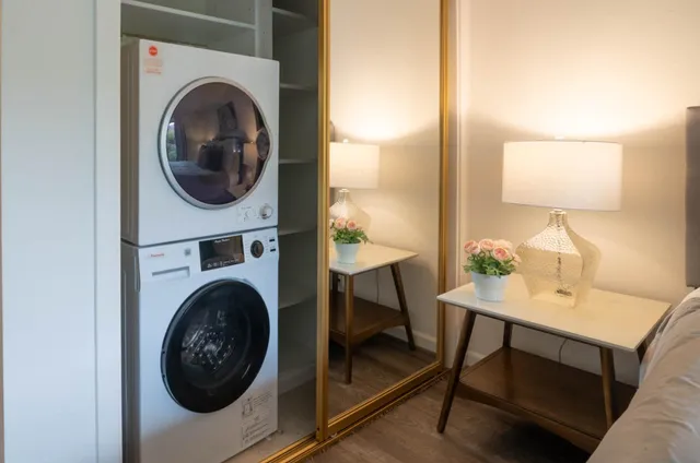a view of a hallway with washer and dryer