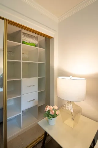 a room with a table and a potted plant