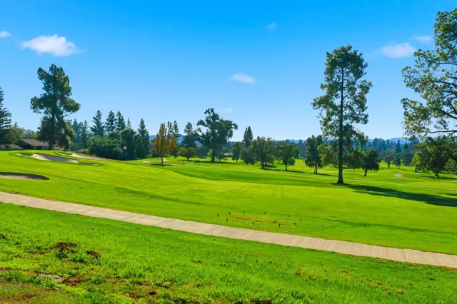 a view of a golf course with a lake view