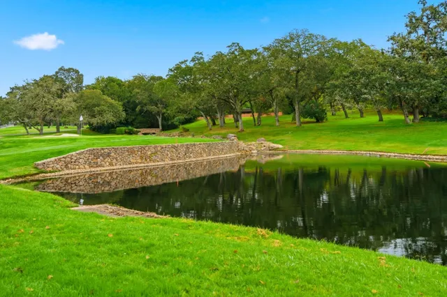 a view of a golf course with a lake