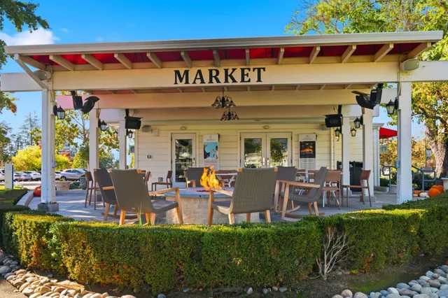 a view of an chairs and table in front of a building