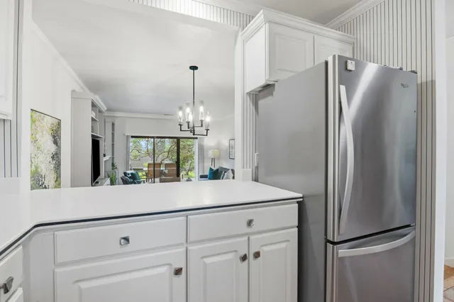 a kitchen with a refrigerator and countertop