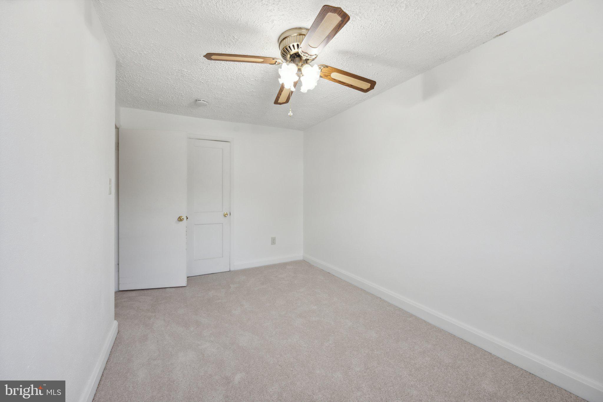 2116 Firethorn Road Middle River, MD 21220 - Photo 11 of 26 an empty room with chandelier fan
