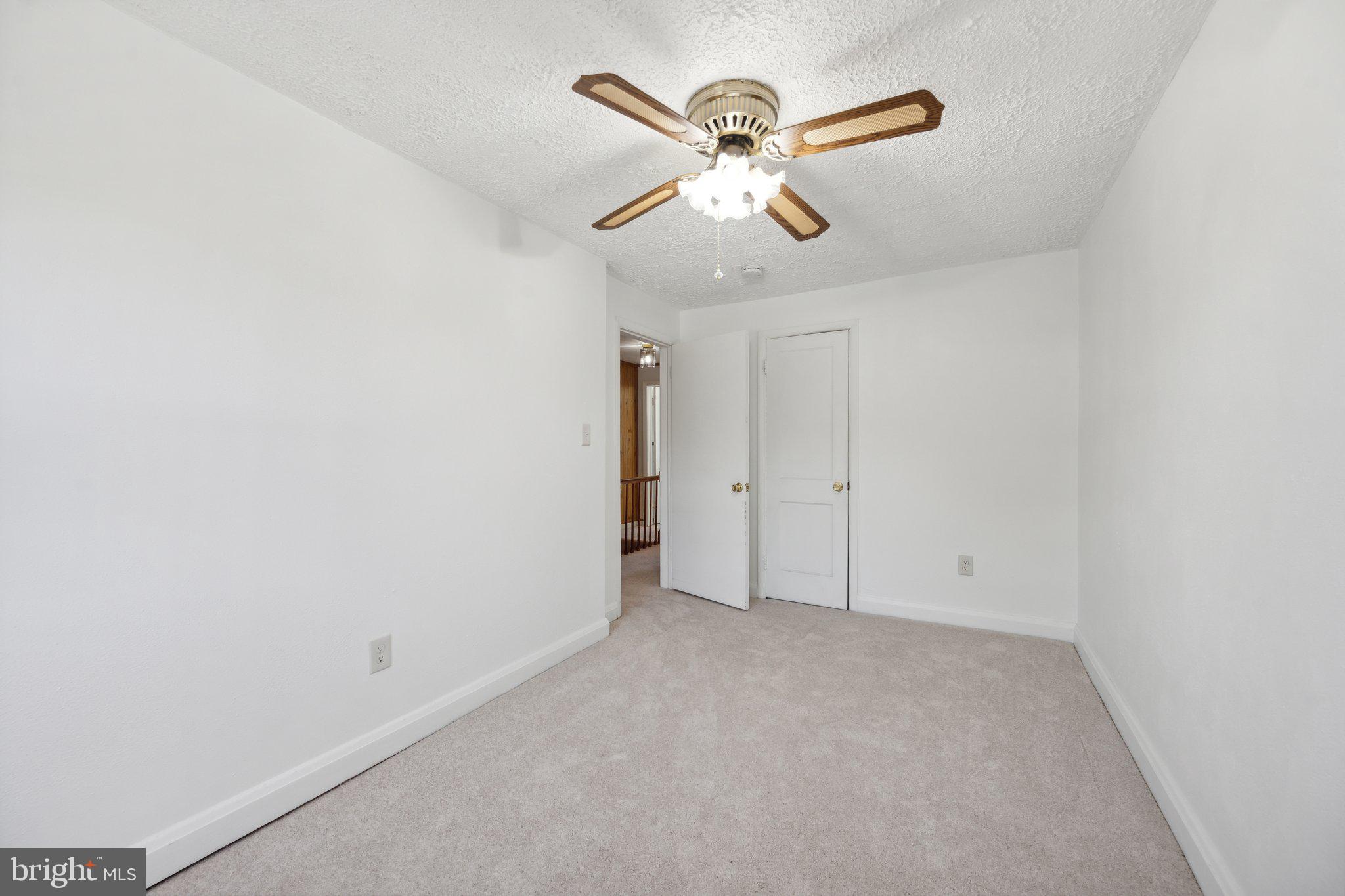 2116 Firethorn Road Middle River, MD 21220 - Photo 12 of 26 an empty room with a fan and a fan