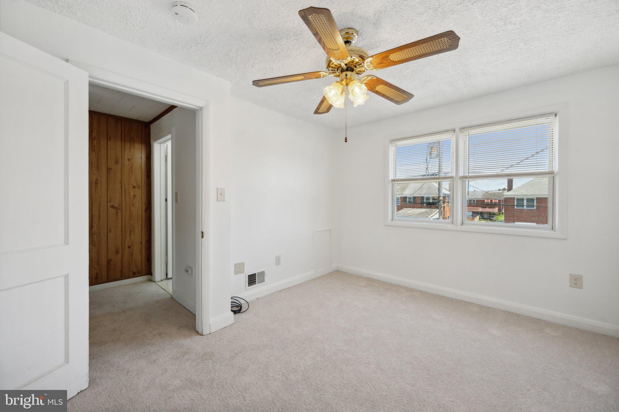 2116 Firethorn Road Middle River, MD 21220 - Photo 13 of 26 an empty room with windows and fan