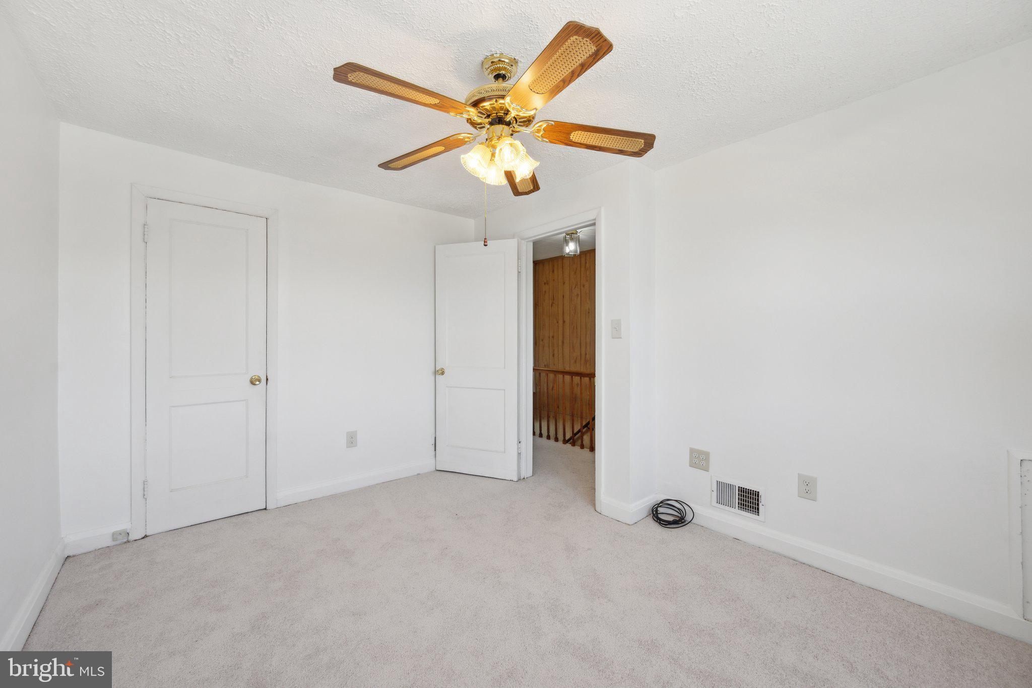 2116 Firethorn Road Middle River, MD 21220 - Photo 14 of 26 an empty room with a ceiling fan and window