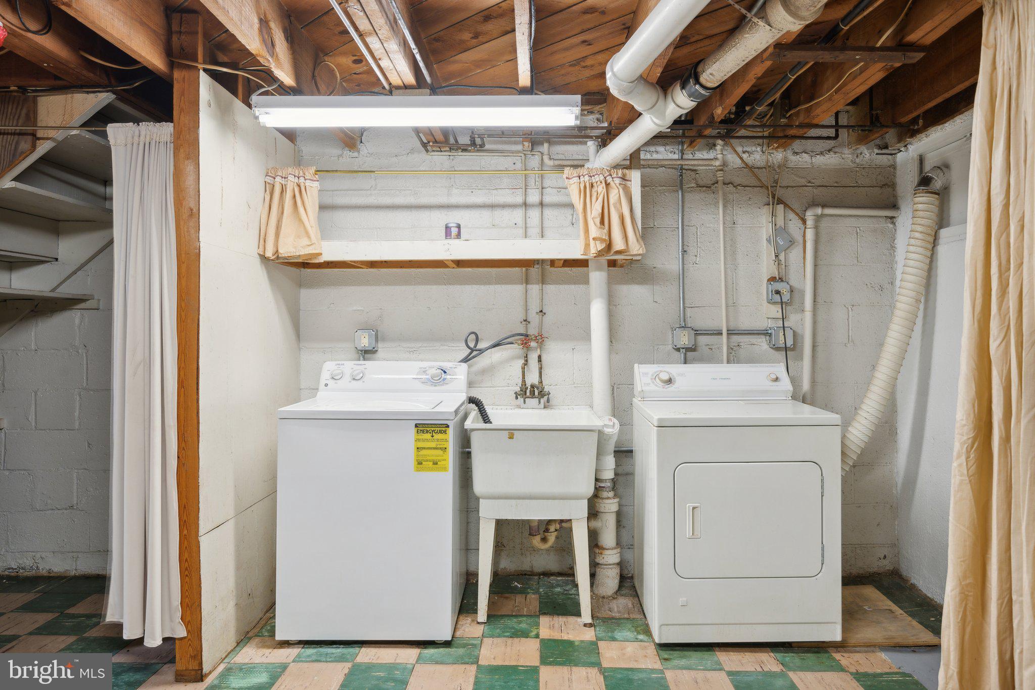 2116 Firethorn Road Middle River, MD 21220 - Photo 22 of 26 a utility room with dryer and washer