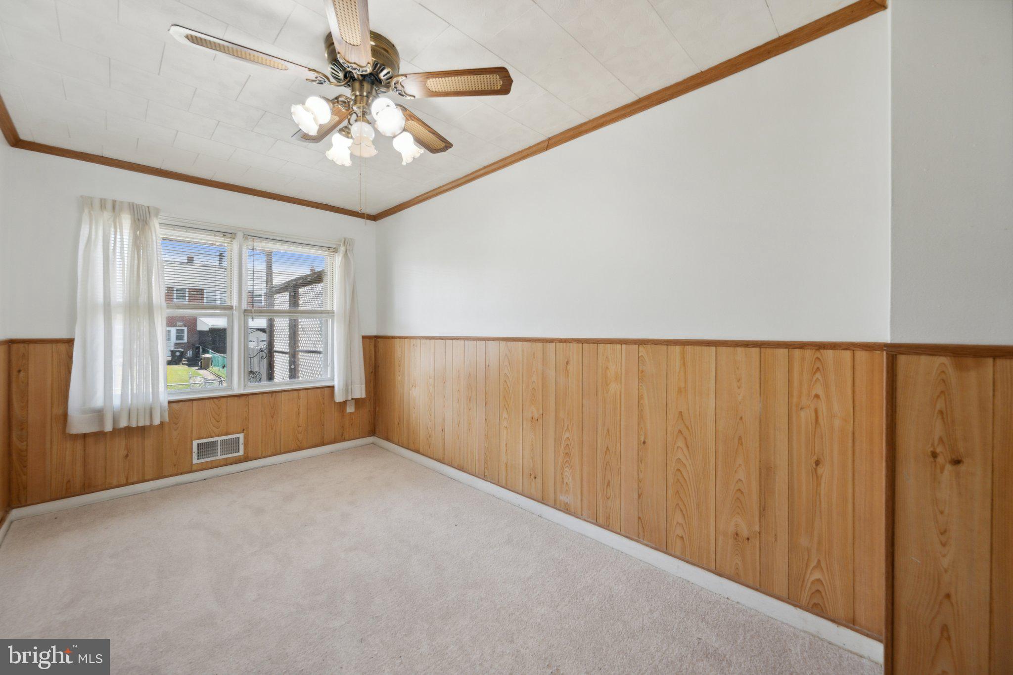 2116 Firethorn Road Middle River, MD 21220 - Photo 5 of 26 a view of an empty room with a window