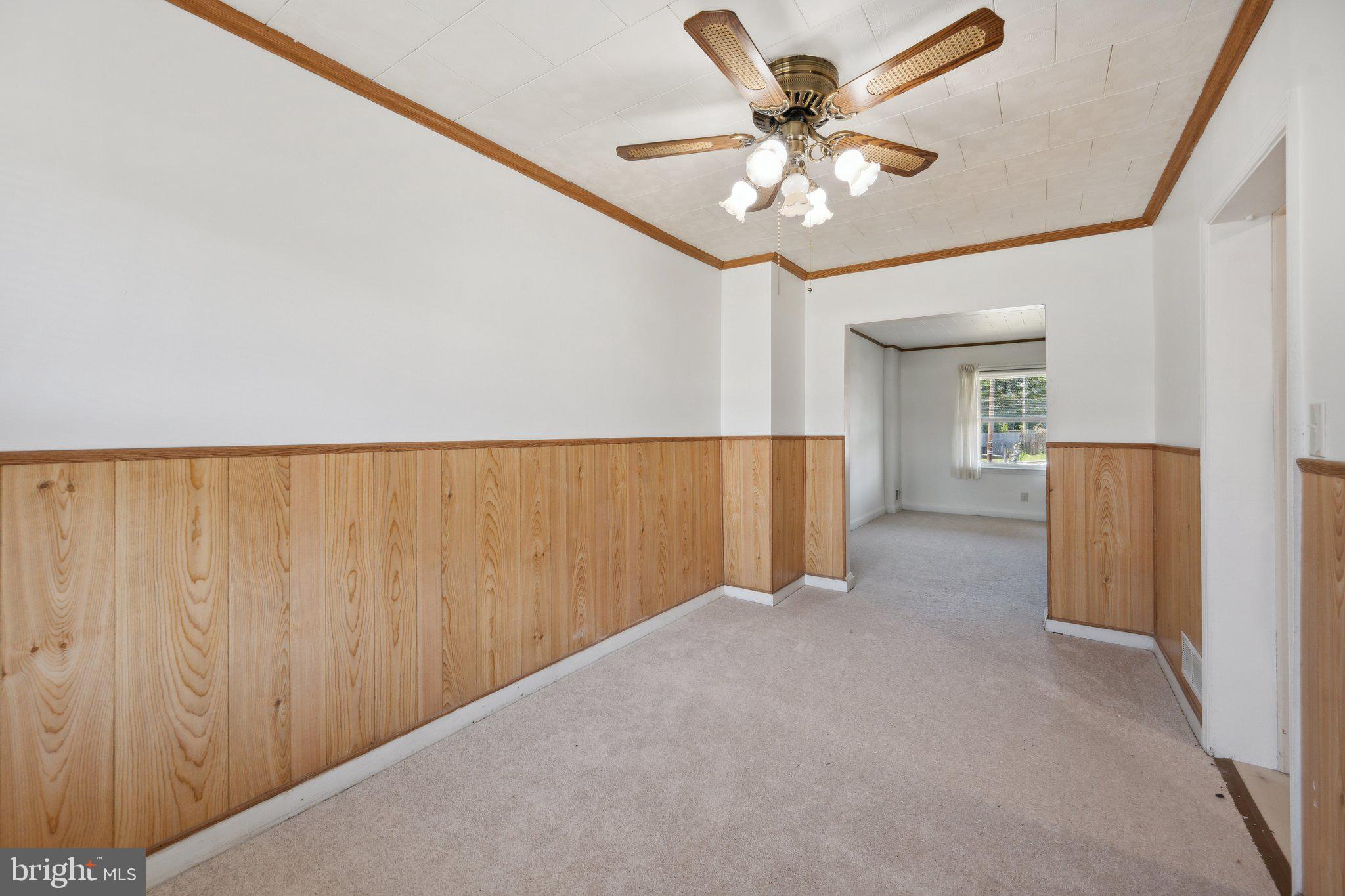 2116 Firethorn Road Middle River, MD 21220 - Photo 6 of 26 a view of a livingroom with a ceiling fan and a chandelier fan
