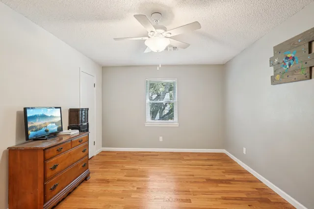 a living room with flat screen tv