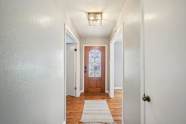 a view of a hallway with windows