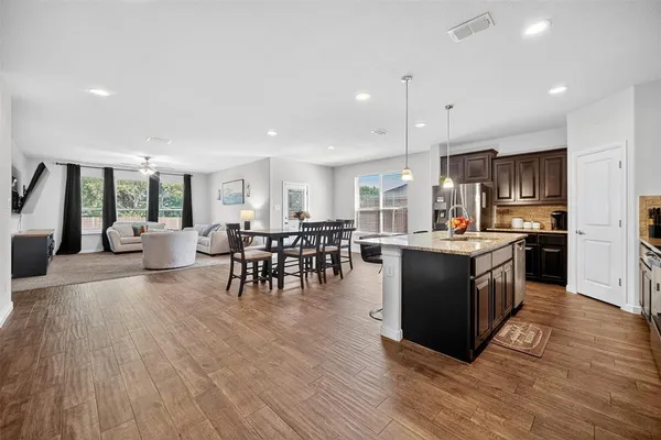 a kitchen with lots of counter top space and stainless steel appliances
