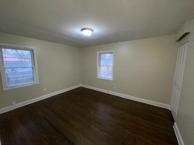 3284 Parham Street Memphis, TN 38127 - Photo 12 of 17 an empty room with wooden floor and windows