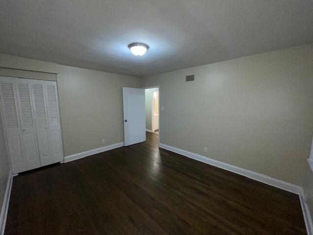 3284 Parham Street Memphis, TN 38127 - Photo 13 of 17 a view of an empty room with wooden floor and a window