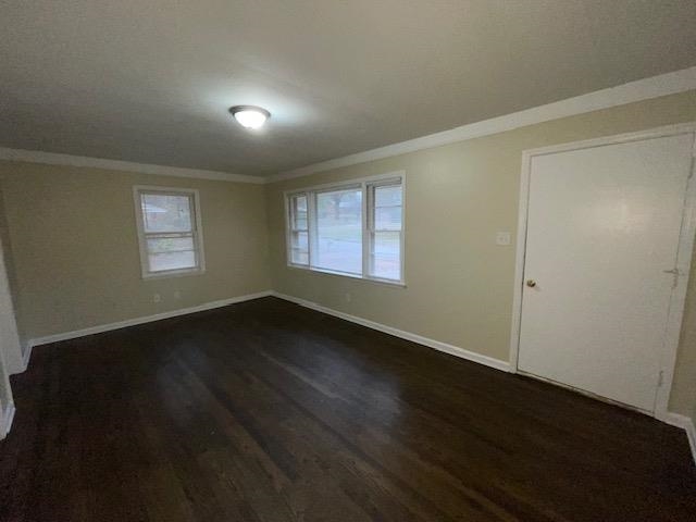 3284 Parham Street Memphis, TN 38127 - Photo 4 of 17 a view of an empty room with wooden floor and a window