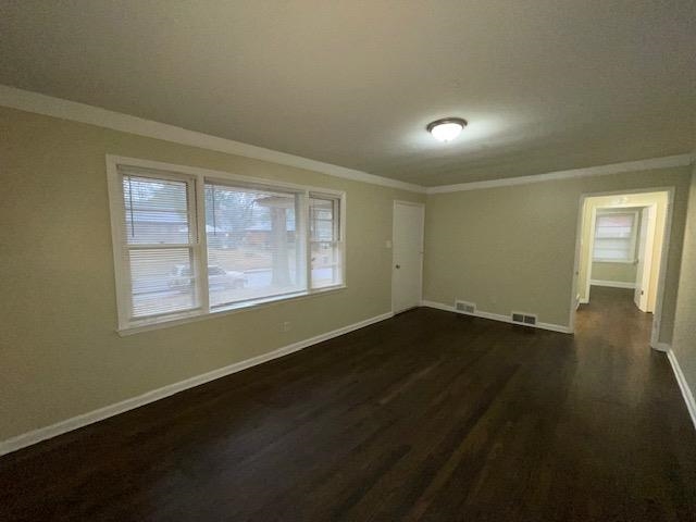 3284 Parham Street Memphis, TN 38127 - Photo 5 of 17 a view of an empty room with wooden floor and a window