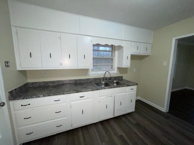 3284 Parham Street Memphis, TN 38127 - Photo 8 of 17 a kitchen with granite countertop white cabinets and stainless steel appliances