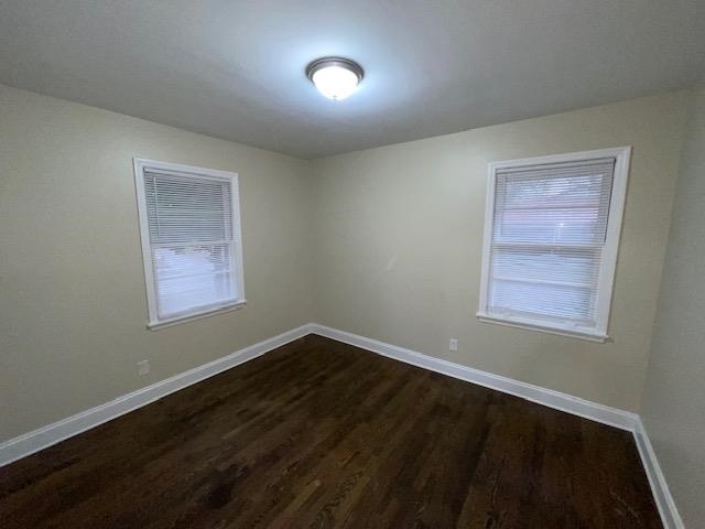 3284 Parham Street Memphis, TN 38127 - Photo 10 of 17 a view of an empty room with wooden floor and a window