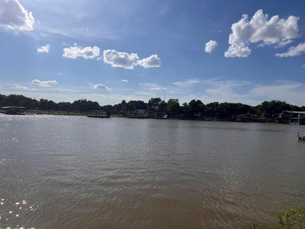 927 Cutter Circle May, TX 76857 - Photo 21 of 23 Waterfront setting with a visible dock structure