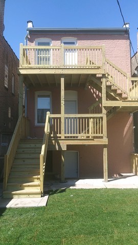 2449 North Ridgeway Avenue, Unit G Chicago, IL 60647 - Photo 7 of 7 a front view of a house with a yard