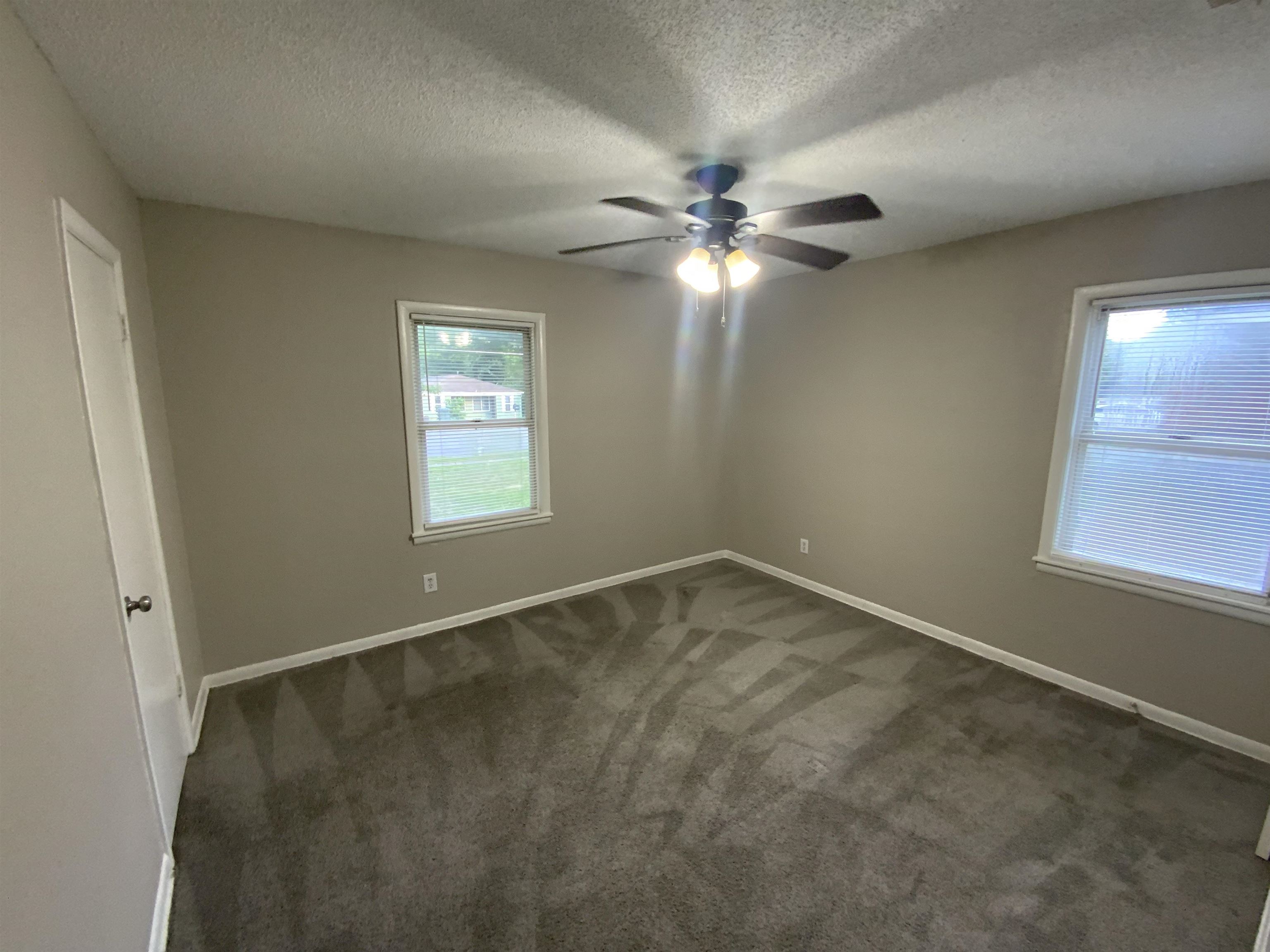 3560 Steele Street Memphis, TN 38127 - Photo 15 of 19 an empty room with windows and fan