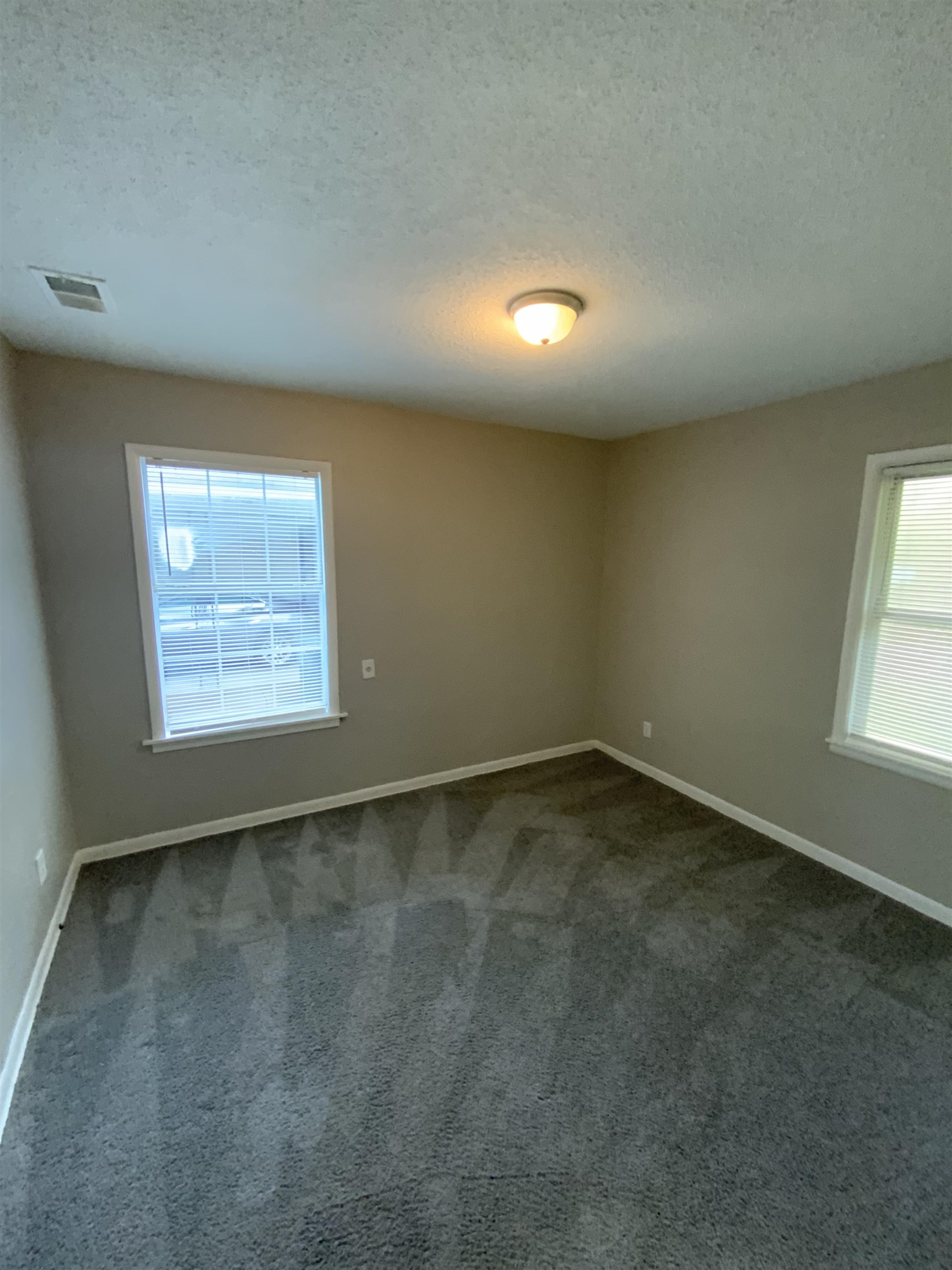3560 Steele Street Memphis, TN 38127 - Photo 17 of 19 an empty room with a empty space and windows