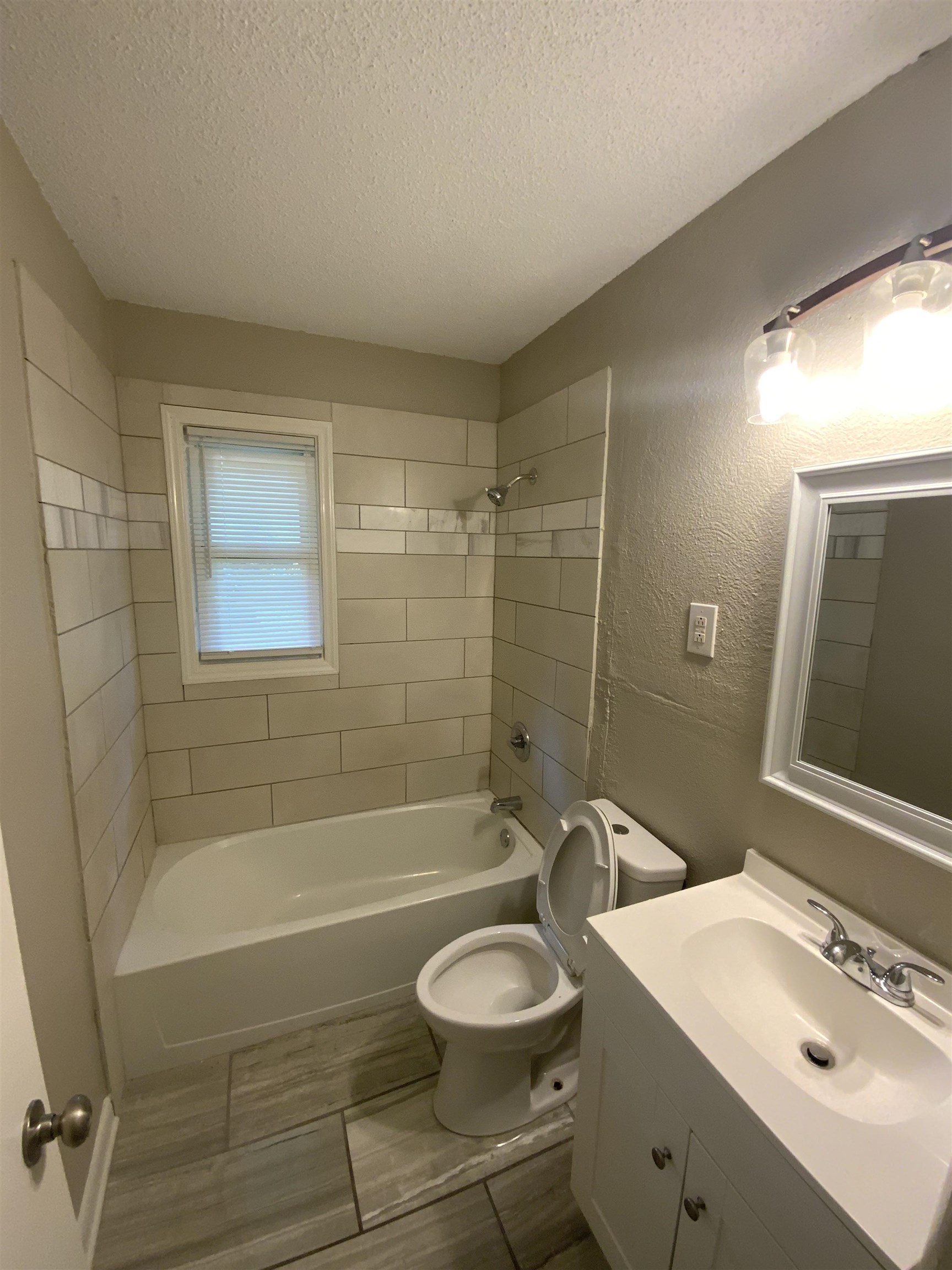 3560 Steele Street Memphis, TN 38127 - Photo 6 of 19 a bathroom with a sink a toilet and shower