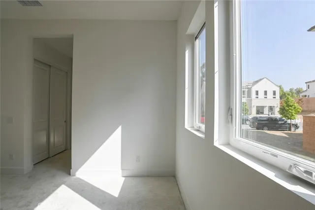 a view of a cafe with a table and chairs in patio