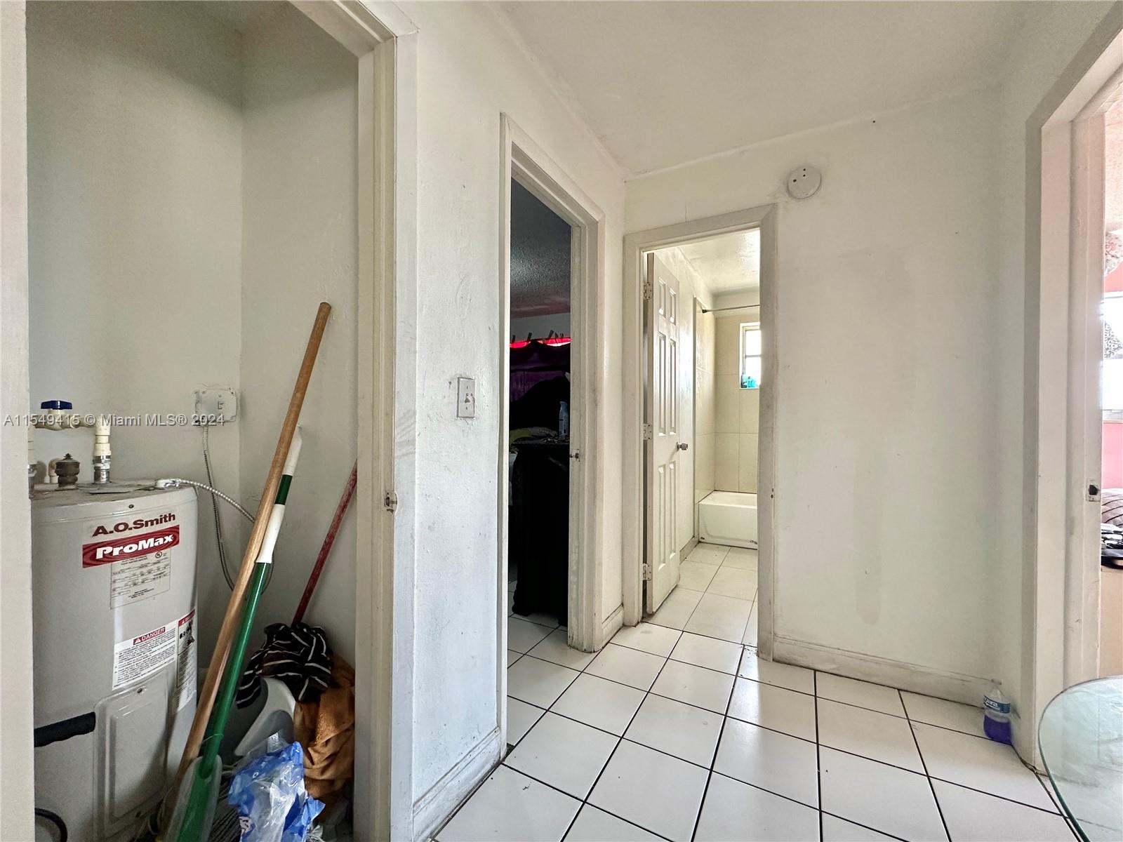 855 West 29th Street, Unit 14 Hialeah, FL 33012 - Photo 12 of 16 a view of a hallway with workspace