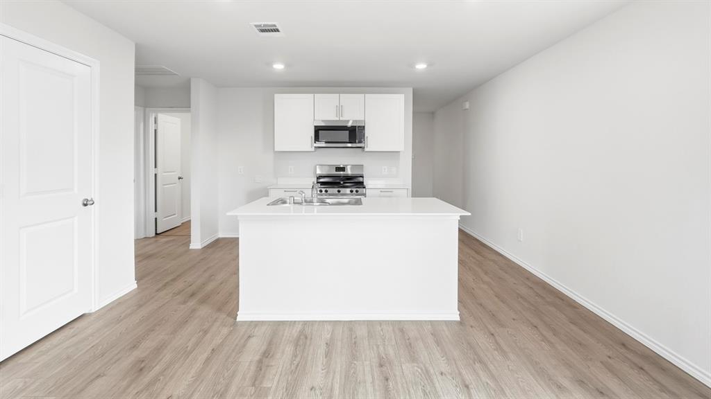 3319 Twilight Trail Forney, TX 75126 - Photo 6 of 33 Contemporary kitchen island with a white countertop and integrated sink