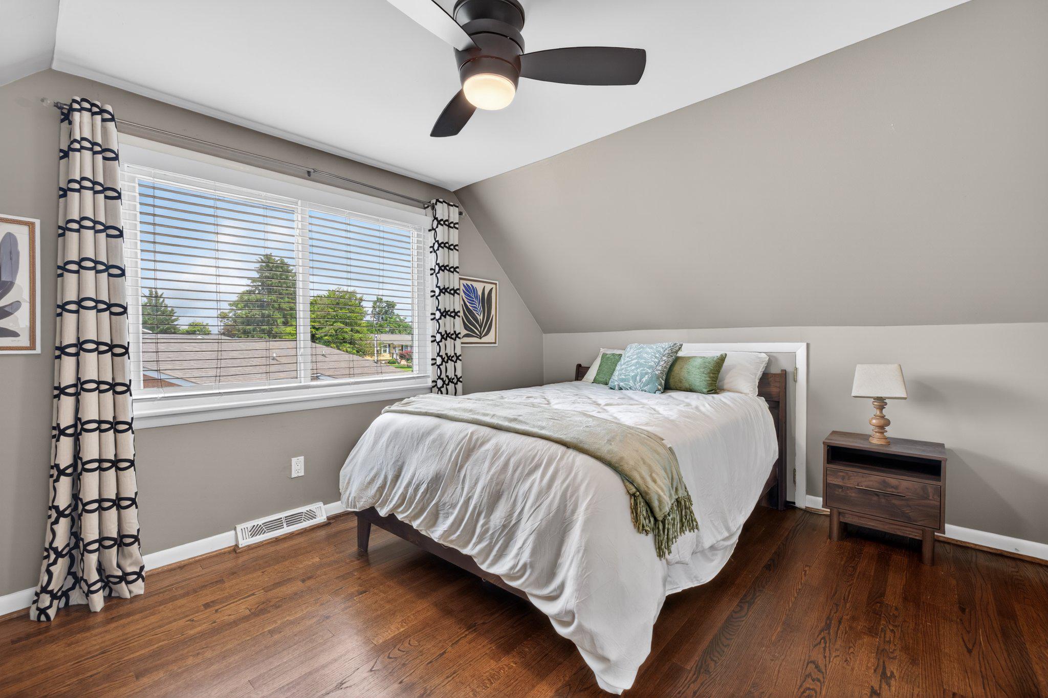 1002 Wilson Place Frederick, MD 21702 - Photo 15 of 30 a bedroom with a bed and a window