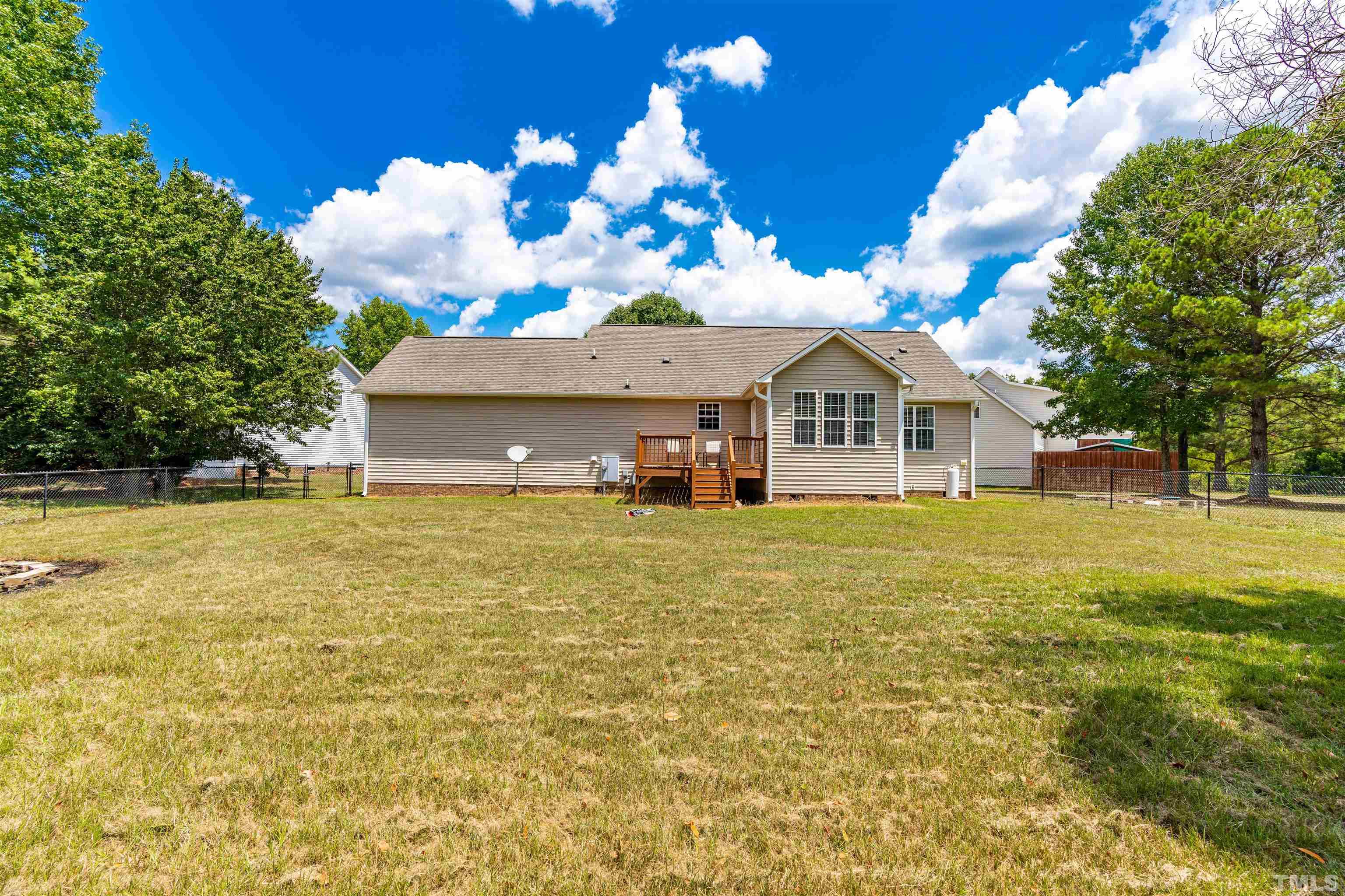 7200 Sunset View Court Willow Spring, NC 27592 - Photo 20 of 25 Lovely fenced yard and deck to enjoy cook outs with family and friends!