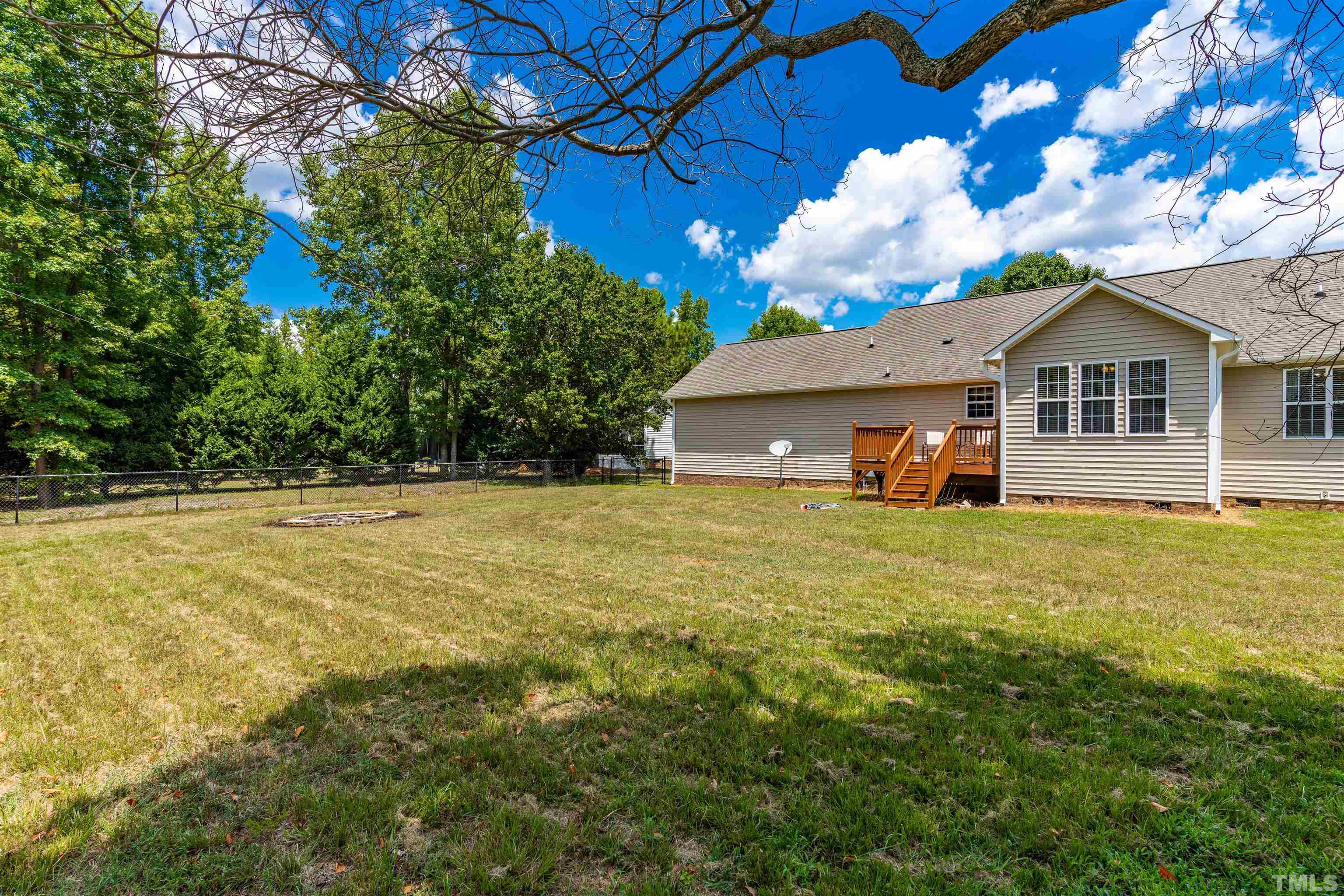 7200 Sunset View Court Willow Spring, NC 27592 - Photo 21 of 25 Terrific yard is fenced and ready for your children or pets!
