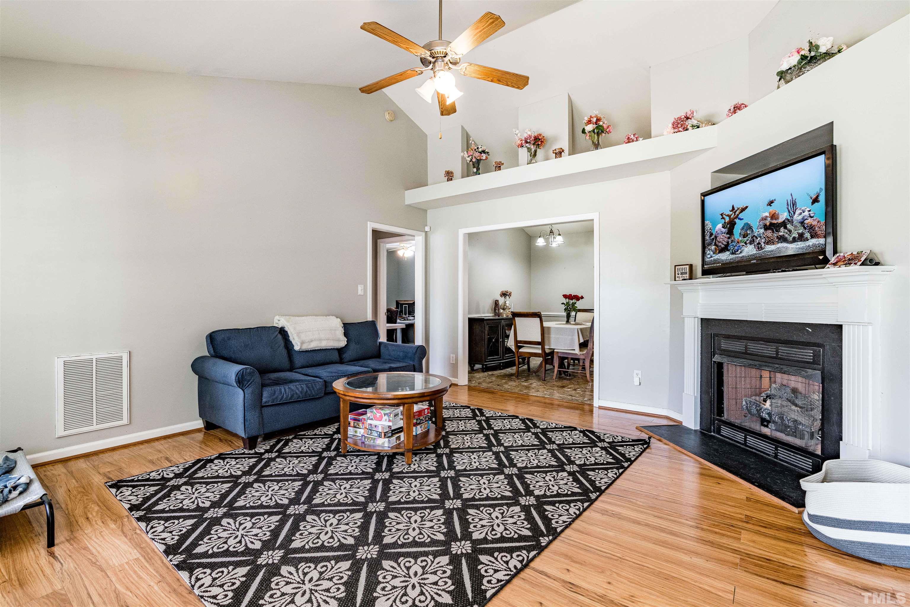 Very open plan with plant shelf and cathedral ceiling between kitchen and family room!